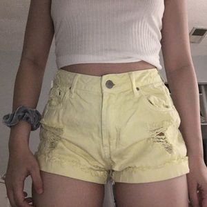 pastel yellow distressed shorts